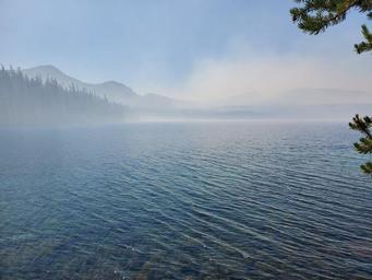 Waldo Lake, mountains and trees visible off in the distance.