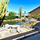 Alternate angle of the same turtle pond area with visible seating, cactus foreground and surrounding landscaping — useful complementary shot for the campground gallery and matches site’s ‘IMG_0566.JPG’ image.