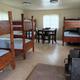 Multiple bunk beds, pot belly stove.