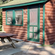Clear photo of a small cabin with picnic table at the entry — useful to illustrate cabin accommodation available on the property (from the Cabins page).