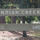 Photograph of the site's entrance sign reading 'INDIAN CREEK REC. AREA' — direct property identifier useful for the gallery and corroborated by the page context.