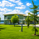 Exterior view of waterfront cabins and surrounding lawn/utility pedestals — shows the park’s cabin accommodation options (file from the property homepage).
