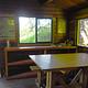 Shakes Slough 1 Cabin interior showing wood cabinets and table