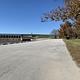 A waterfront view and a large parking lot for visitors to park and enjoy the river and Keystone dam scenery.