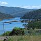 Wide scenic view over the nearby reservoir/lake (Oroville area) showing marina and surrounding hills — good aerial/overview shot establishing the park's lakeside setting (from site homepage image).