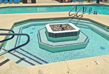 Close-up of a spa/whirlpool within the pool complex, highlighting on-site spa amenities visible on the resort’s facilities page.