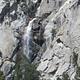 Waterfall surrounded by rock outcroppings