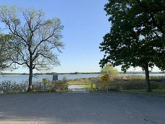small boat ramp with trees