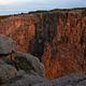 Sunlit Black Canyon of the Gunnison cliff face as seen from the South Rim 