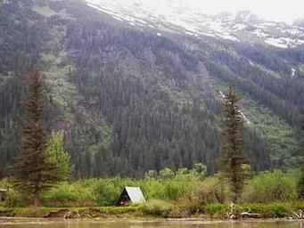 Twin Lakes Cabin in front of large snowcapped mountains