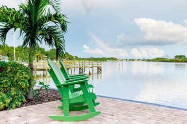 Waterfront seating area facing the river with dock in view — good scenic amenity shot; appears on the park’s Our Park gallery.