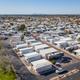 Aerial photograph focused on residential/RV rows and streets within the park, showing lot layout and nearby green space — useful for illustrating campground RV pitches (file labelled ‘Southern-Aerial-13’).