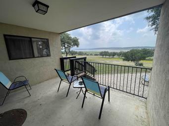 Condo porch overlooking the lake and park grounds — demonstrates condo accommodations and lake view on the property (condo photo on main site).