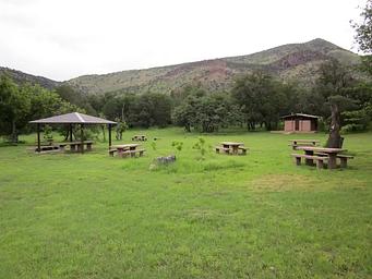 Picnic area with 4 tables and bathroom