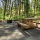 Picnic table and fire pit in a campsite