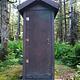 Mount Rynda Cabin outhouse with trees surrounding