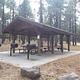 Day use picnic area with grills, tables, and a shade structure