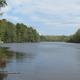 Wide lake view showing shoreline and water — represents the campground’s waterfront (photo gallery lake shot).