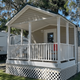 Mobile home with white porch railing