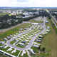 High aerial overview of the resort showing the RV pads, paved roads, site layout and surrounding highway — useful for giving visitors a sense of property scale and arrangement (source: Home page drone image).