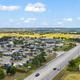 Aerial overview showing the full RV resort layout, road access, parking and surrounding landscape — useful for an overall property view (page gallery/social images confirm onsite).
