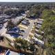 Oblique drone view showing the main office/building and rows of RV sites — good contextual overview of campground location and surroundings (from site homepage/gallery drone photos).