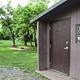 Vault Toilet and Campsite in background