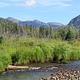 A View of Timber Creek with Mountains in the Background