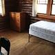 single bed, chest of drawers inside cabin