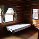 Single bed inside a cabin