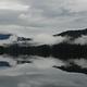 View of lake and mountains from Virginia Lake Cabin with misty clouds over lake