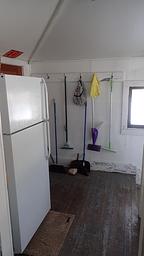 Back room with refrigerator 