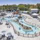 Aerial overview of the resort’s pool/waterpark and lazy river — shows layout, multiple pools, cabanas and walkways. Image comes from the property homepage (towerparkresort.com) and clearly depicts on-site aquatic facilities.