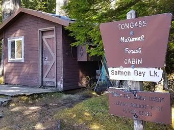 Salmon Bay Lake Cabin and sign.