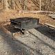 Large metal cooking grill at campsite