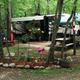 Close-up of an RV site with decorated campsite area, plantings and picnic table — demonstrates campsite personalization and amenities available. Source is the campground website image gallery. 