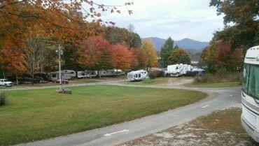Fall-season wide vantage showing many RVs, road curves and mountain backdrop — good seasonal/overview shot of the campground layout (source: Big Rig Sites page).
