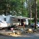 Clear photo of an RV parked at a numbered campsite with picnic table, fire ring and gravel pad — shows a typical on-site RV pitch and campsite amenities (from the property page).