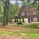 Lodge/office building set among trees on the property — useful to show on‑site buildings and wooded setting (appears in site Contact/Info pages).