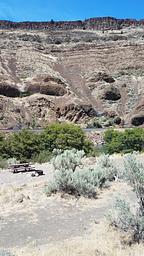View of canyon rim, Deschutes River and campsite in Long Bend Campground