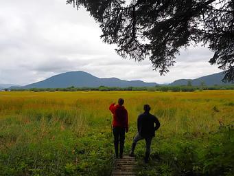 Visitors looking at the view from Sergief Island Cabin