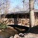 Travertine Creek flows under a stone bridge at the Travertine Nature Center