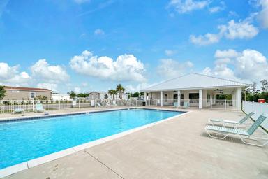 Swimming Pool and Clubhouse at Riverwalk Landing Senior Living Community