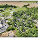 Aerial overview showing campground layout, pool, buildings and surrounding farmland — good overall site view (matches site’s drone/’drone photo’ context).