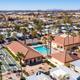 Aerial overview of the campground showing rows of RVs and streets — useful for layout and site density. Matches property page context (resort exterior photos).