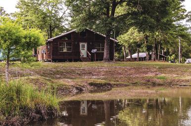 view of clubhouse from pond