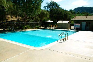 Clear photo of the park swimming pool and surrounding deck — useful facility shot from the campground gallery (page: https://www.woodsvalley.com/our-campgound/).