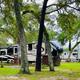RV parked among trees in campground