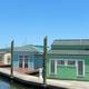 Waterfront floating villas/dock along the marina — clear exterior view showing unique floating accommodations; image sourced from the property photo gallery page (photo-gallery/) and homepage image file (new-photo-villas-and-rentals.jpg).