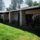 Photo of on-site residential building with landscaping and lawn area — demonstrates accommodation/grounds on the Twin View Terrace property (gallery image).